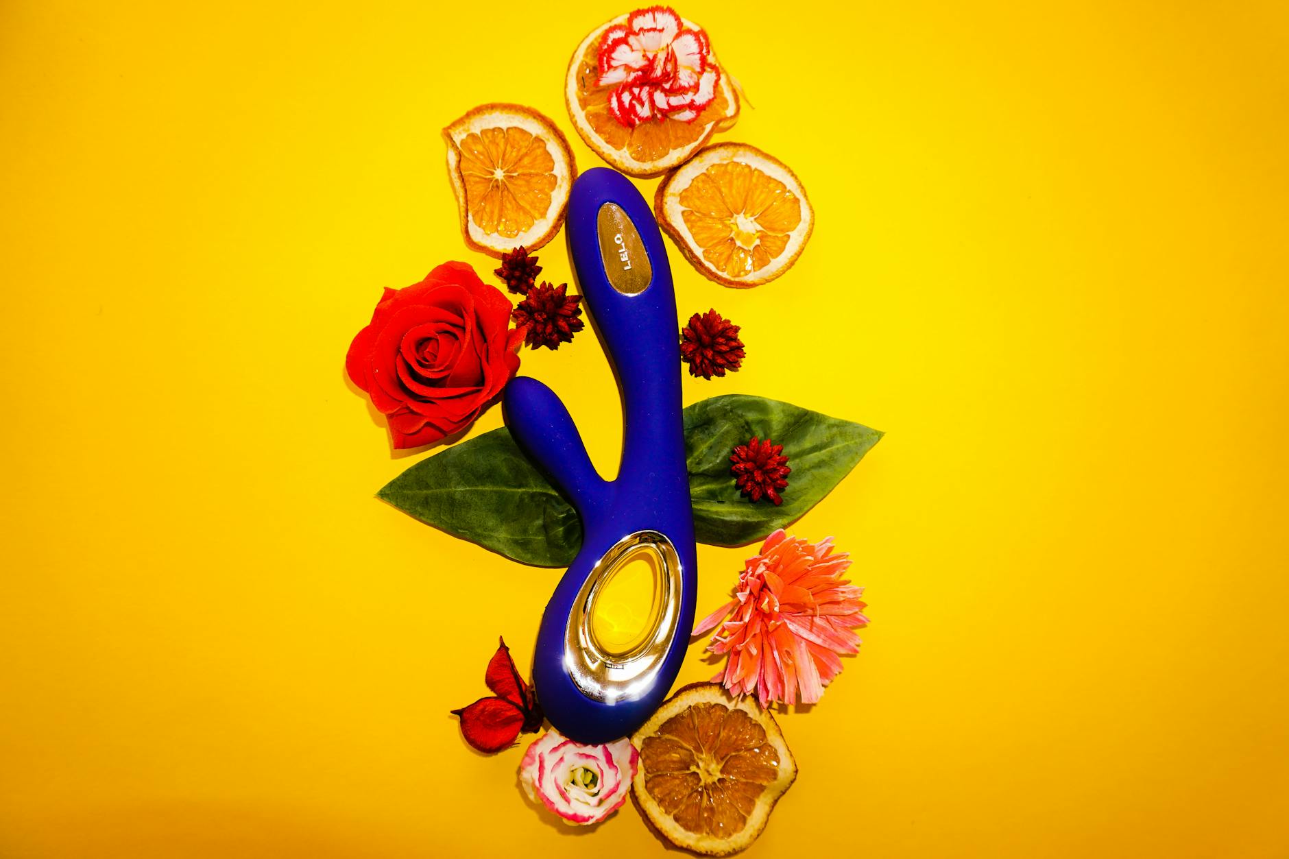 A young couple holding a blue vibrator together, symbolizing shared intimacy and synchronized pleasure